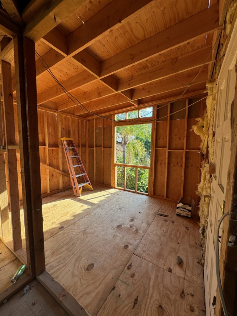 Room underconstruction, exposed wood studs