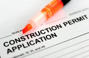 paper bold letter construction permit, orange marker